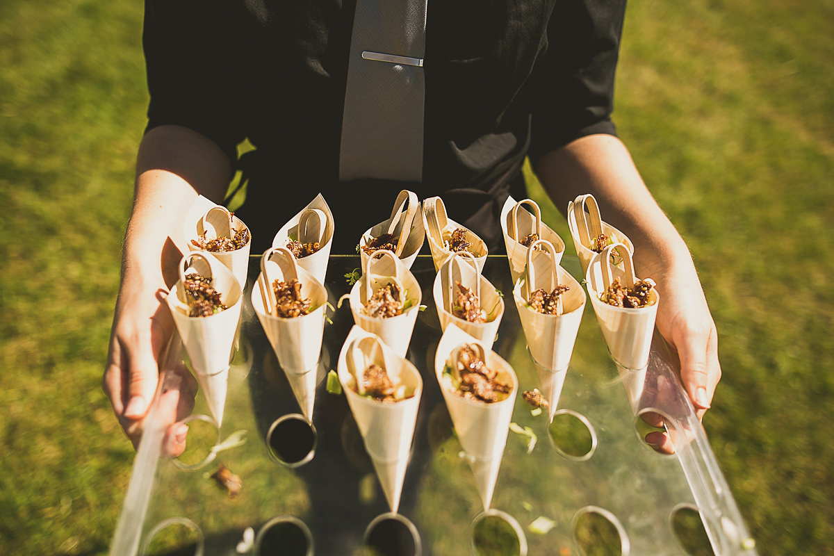 Ashleigh wore an elegant Charlie Brear gown for her sunshine and sunflower filled wedding. A Mariachi band entertained guests at the reception. Bridesmaids wore ASOS. Photography by The Springles.