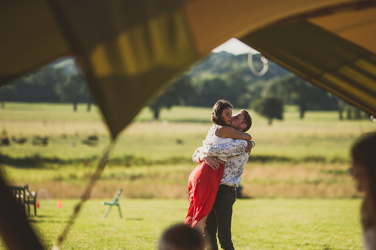 Ashleigh wore an elegant Charlie Brear gown for her sunshine and sunflower filled wedding. A Mariachi band entertained guests at the reception. Bridesmaids wore ASOS. Photography by The Springles.