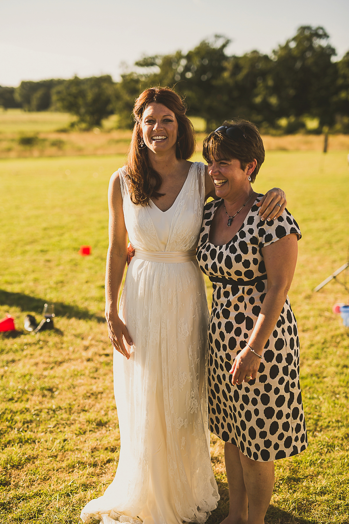 Ashleigh wore an elegant Charlie Brear gown for her sunshine and sunflower filled wedding. A Mariachi band entertained guests at the reception. Bridesmaids wore ASOS. Photography by The Springles.