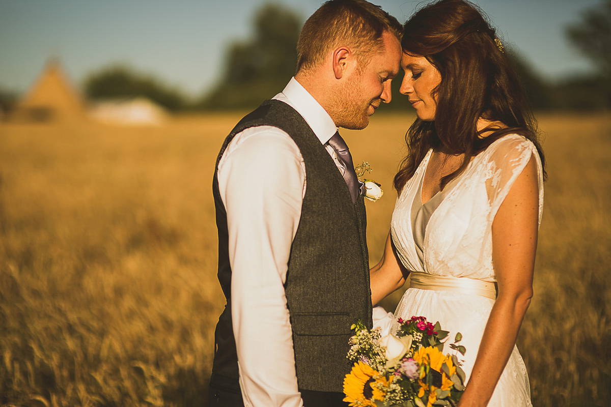 Ashleigh wore an elegant Charlie Brear gown for her sunshine and sunflower filled wedding. A Mariachi band entertained guests at the reception. Bridesmaids wore ASOS. Photography by The Springles.