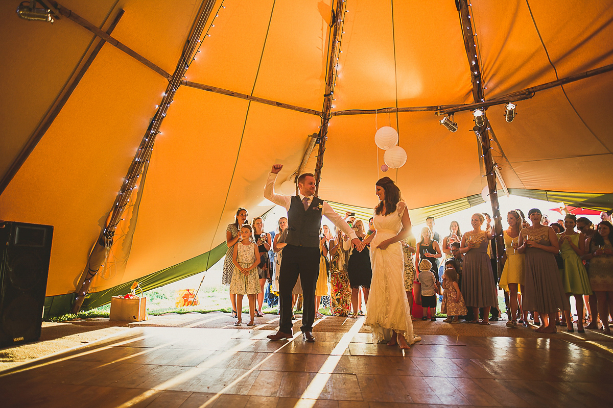 Ashleigh wore an elegant Charlie Brear gown for her sunshine and sunflower filled wedding. A Mariachi band entertained guests at the reception. Bridesmaids wore ASOS. Photography by The Springles.