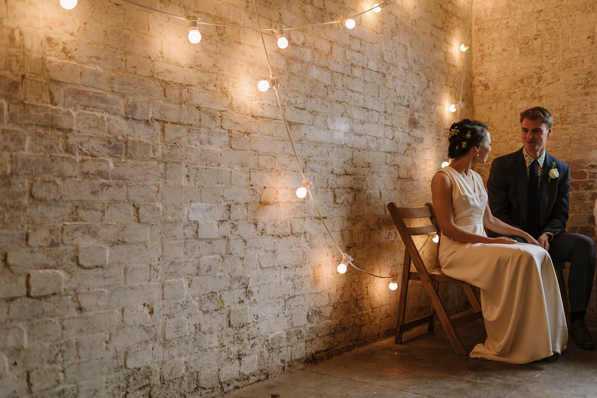 Ruth wore a J.Crew dress for her modern, cool, London warehouse wedding. Photography by Thierry Joubert.