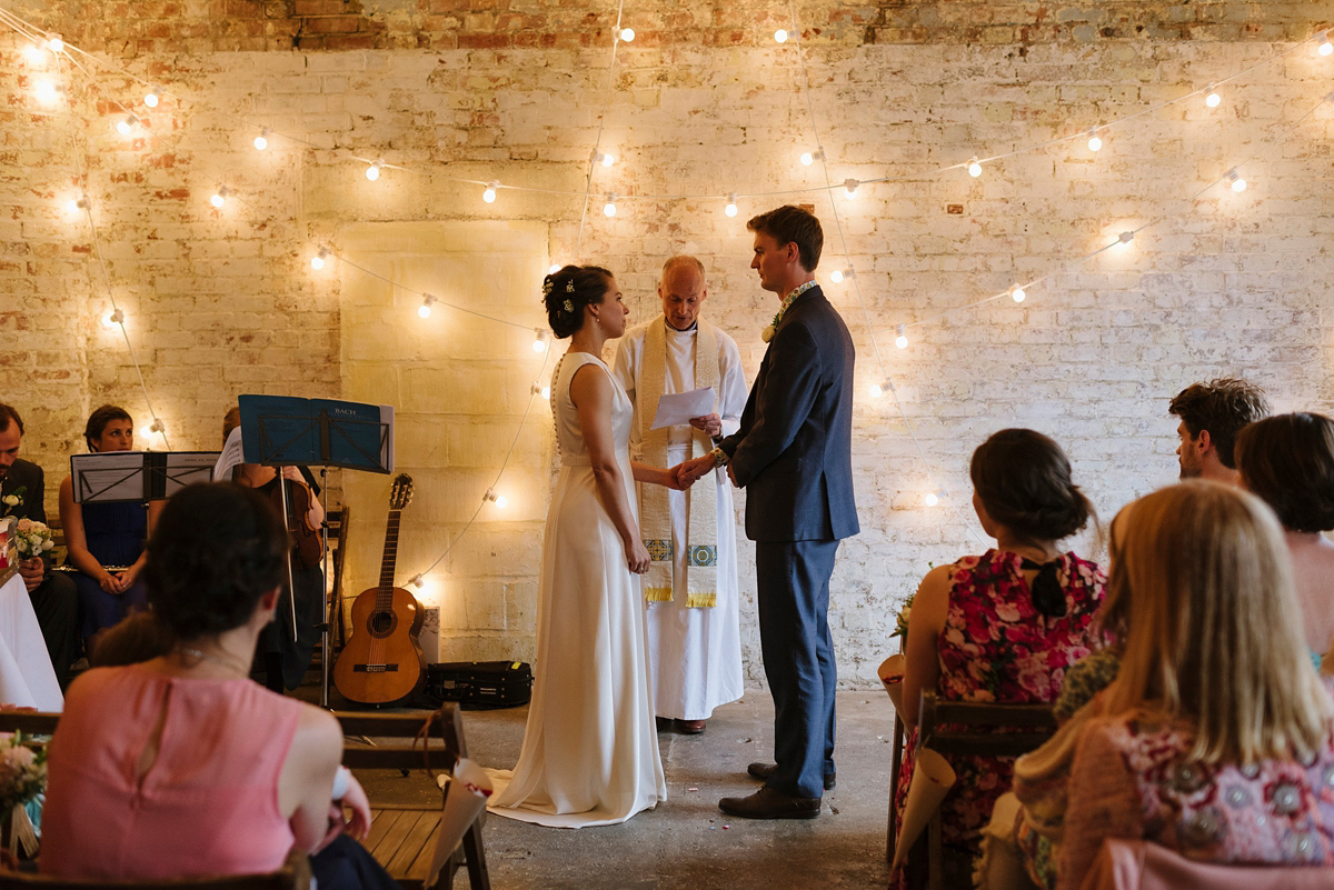 Ruth wore a J.Crew dress for her modern, cool, London warehouse wedding. Photography by Thierry Joubert.