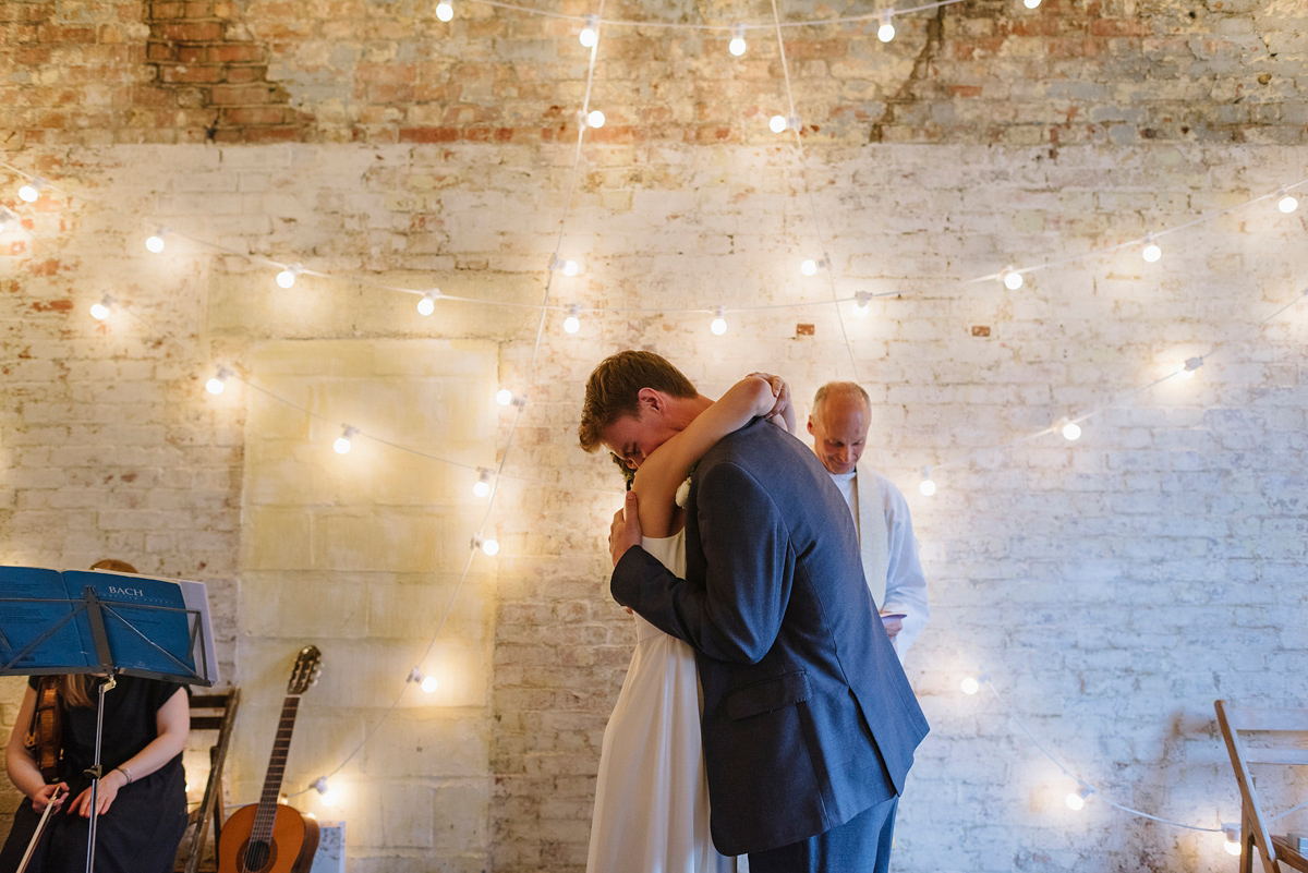 Ruth wore a J.Crew dress for her modern, cool, London warehouse wedding. Photography by Thierry Joubert.