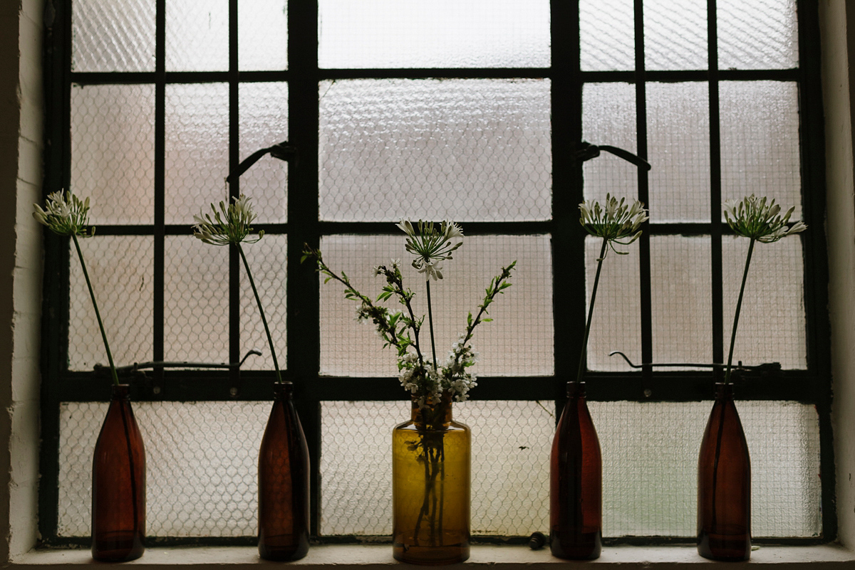 Ruth wore a J.Crew dress for her modern, cool, London warehouse wedding. Photography by Thierry Joubert.