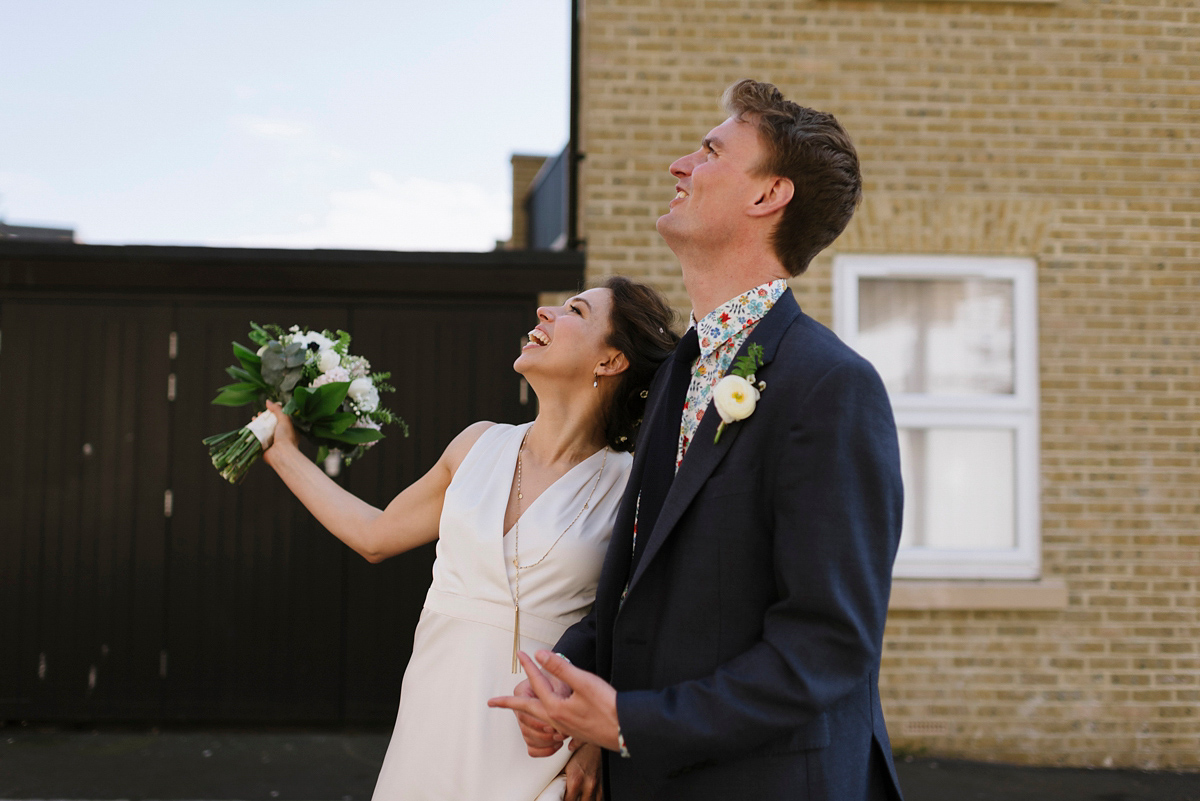 Ruth wore a J.Crew dress for her modern, cool, London warehouse wedding. Photography by Thierry Joubert.