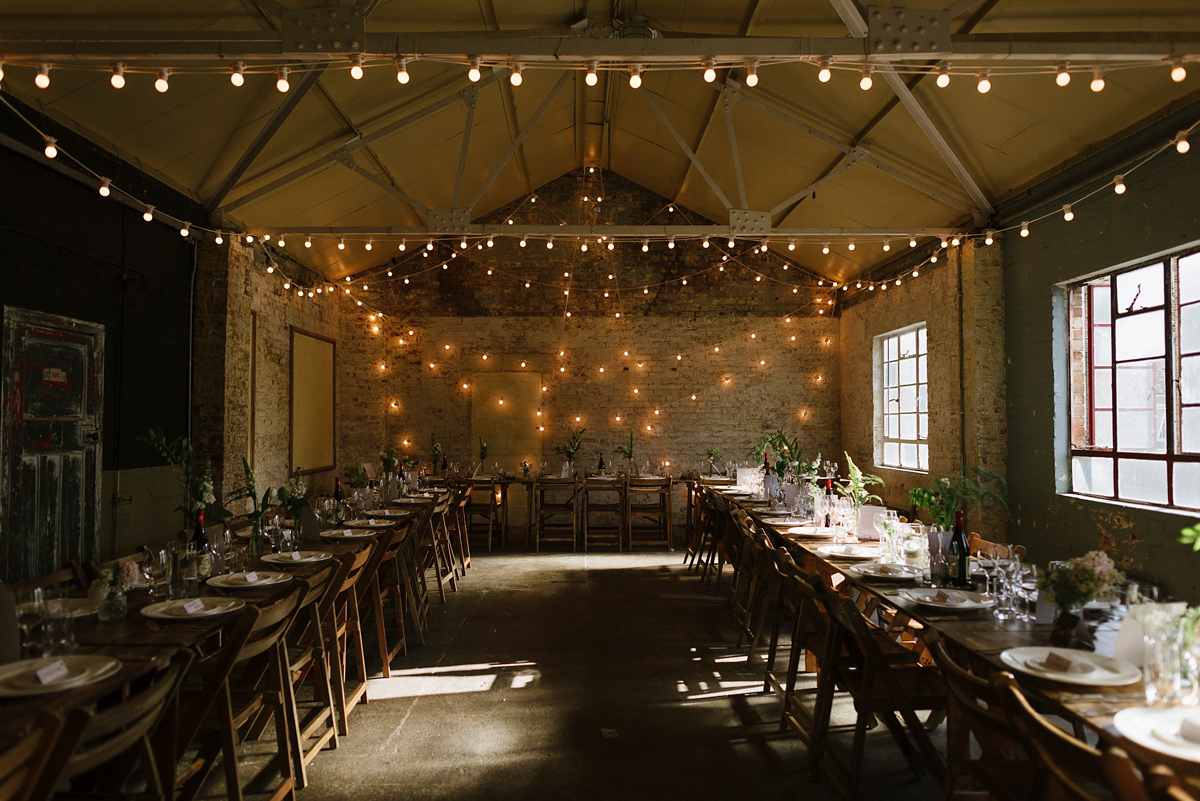 Ruth wore a J.Crew dress for her modern, cool, London warehouse wedding. Photography by Thierry Joubert.