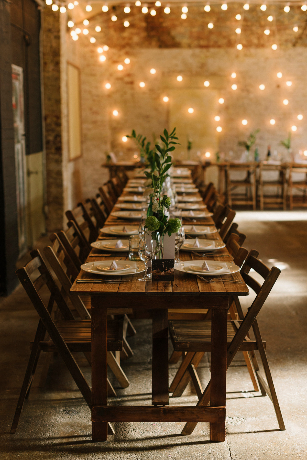 Ruth wore a J.Crew dress for her modern, cool, London warehouse wedding. Photography by Thierry Joubert.