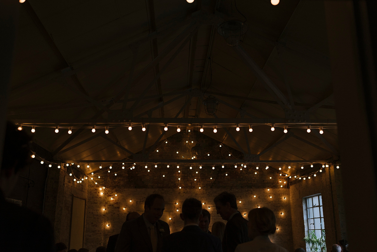 Ruth wore a J.Crew dress for her modern, cool, London warehouse wedding. Photography by Thierry Joubert.