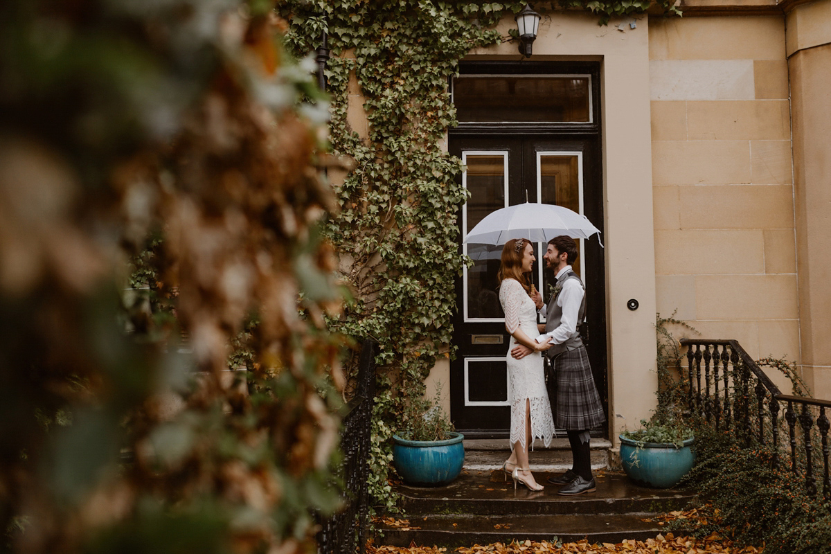 Katie wore a For Love & Lemons dress for her cool, modern, warehouse wedding in Glasgow. Photography by The Curries.