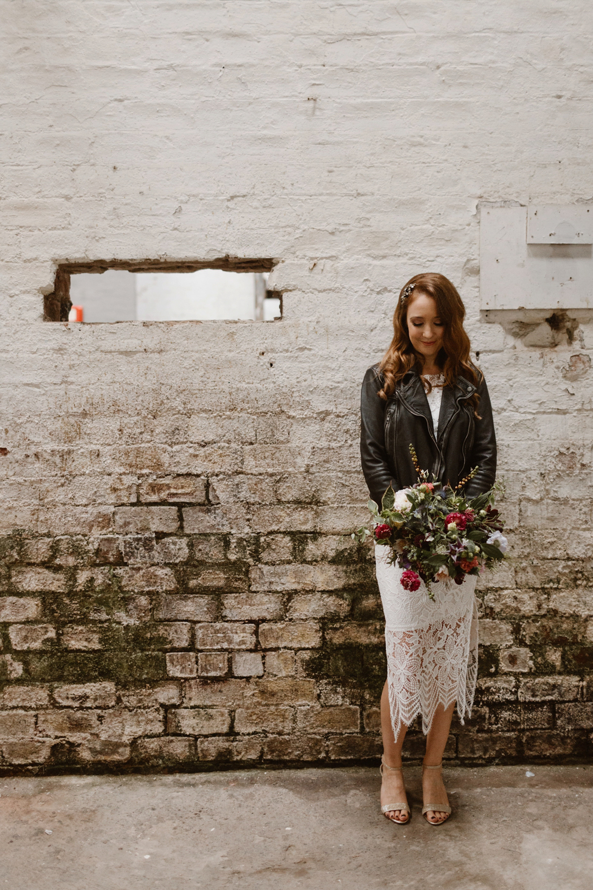 Katie wore a For Love & Lemons dress for her cool, modern, warehouse wedding in Glasgow. Photography by The Curries.