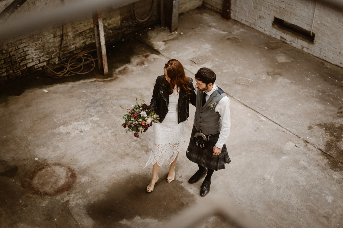 Katie wore a For Love & Lemons dress for her cool, modern, warehouse wedding in Glasgow. Photography by The Curries.