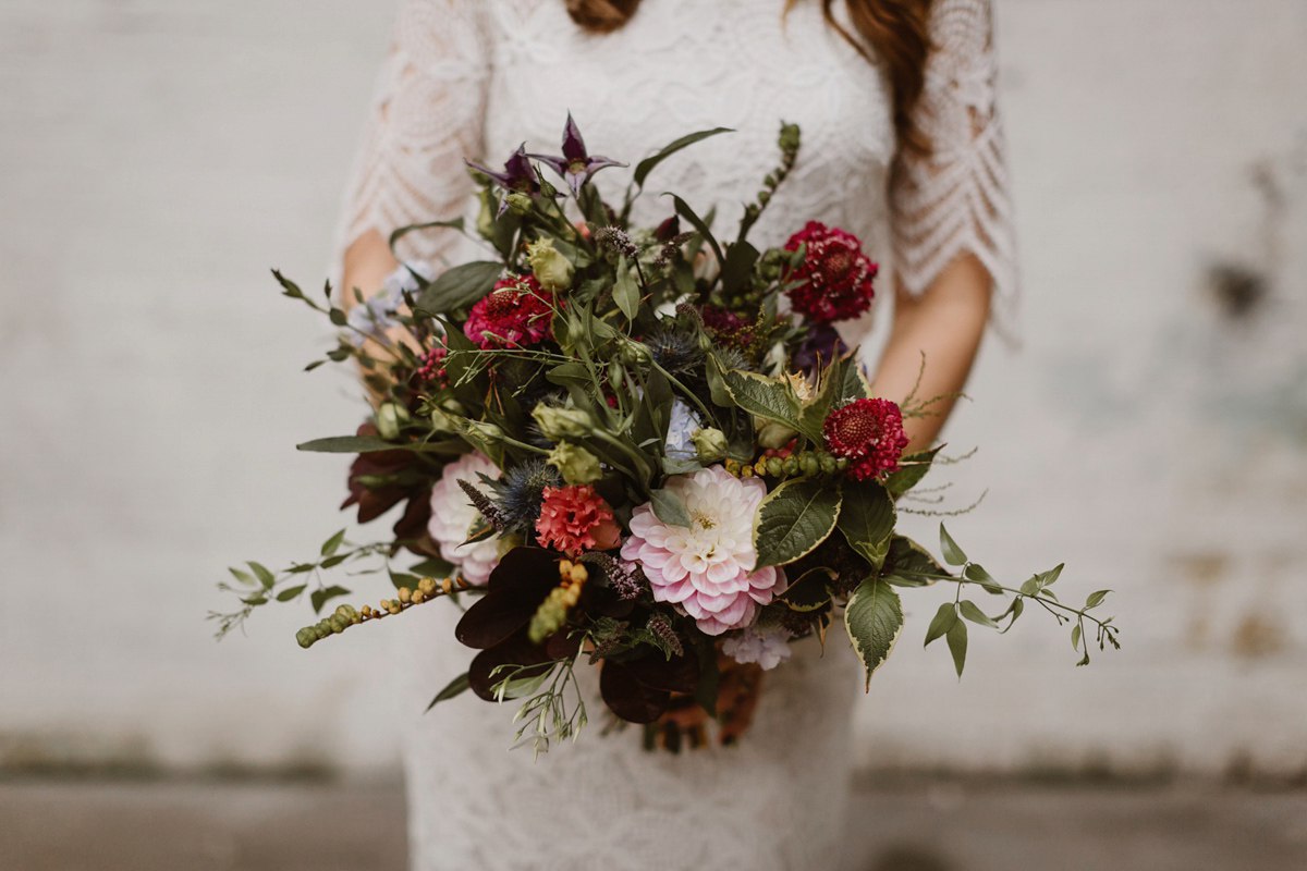 Katie wore a For Love & Lemons dress for her cool, modern, warehouse wedding in Glasgow. Photography by The Curries.