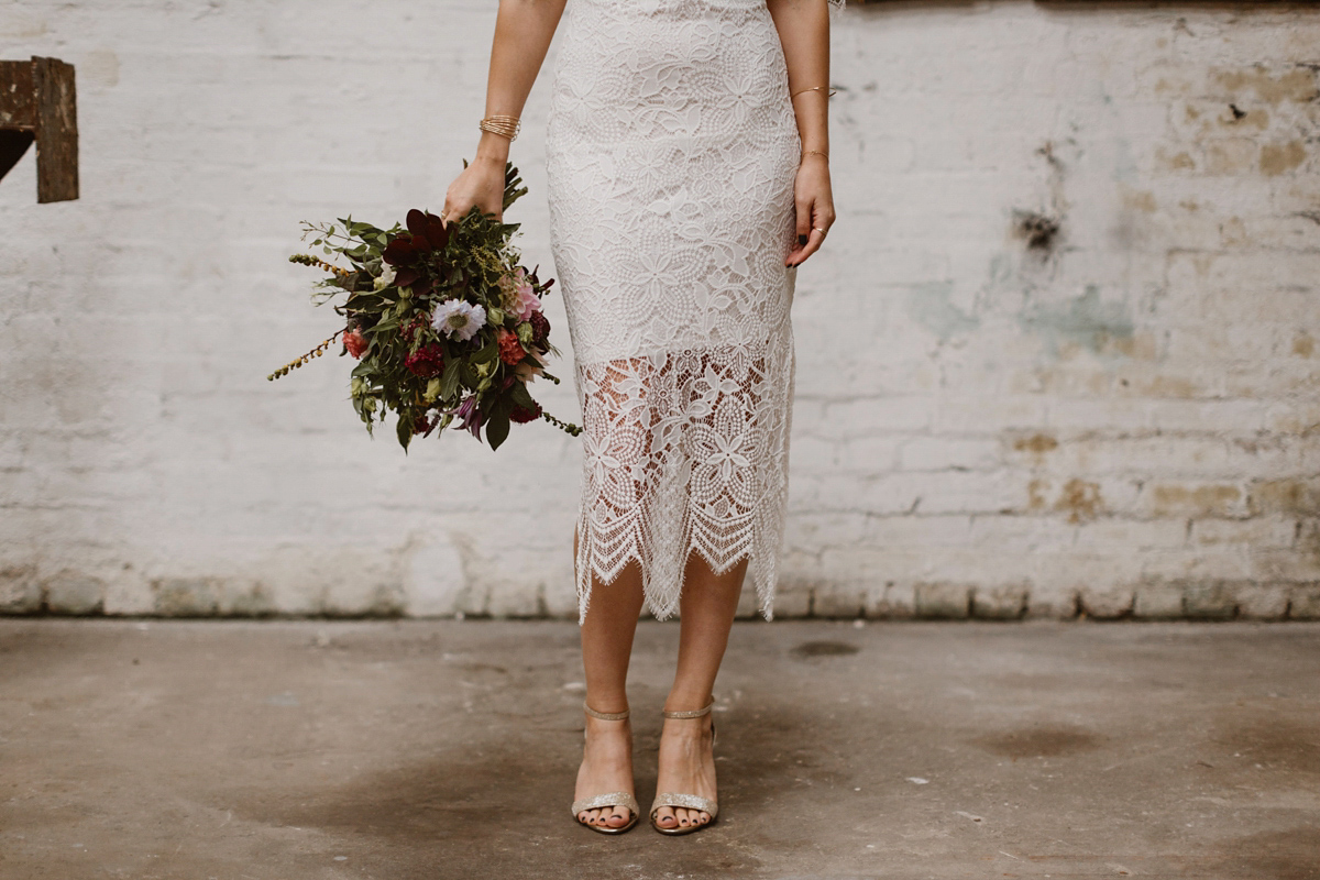 Katie wore a For Love & Lemons dress for her cool, modern, warehouse wedding in Glasgow. Photography by The Curries.