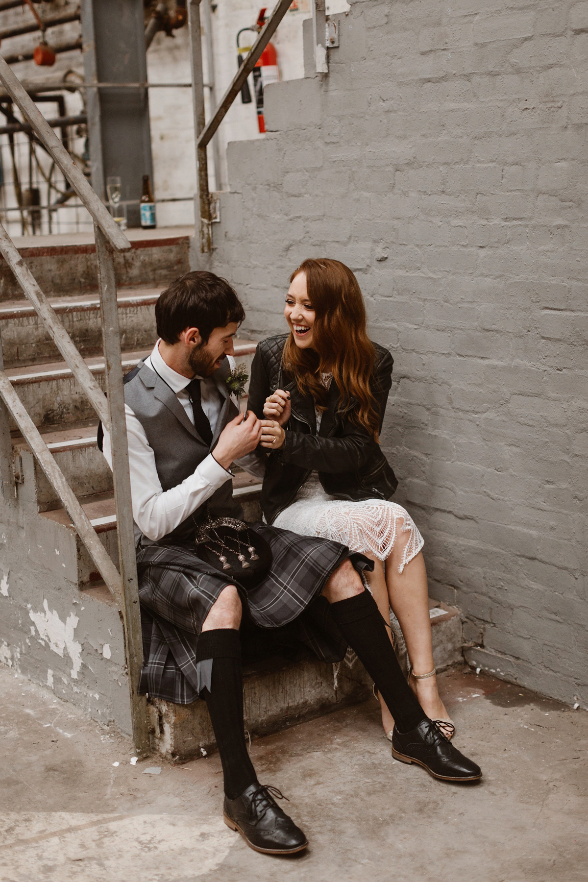 Katie wore a For Love & Lemons dress for her cool, modern, warehouse wedding in Glasgow. Photography by The Curries.