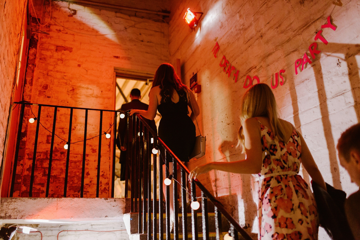 Katie wore a For Love & Lemons dress for her cool, modern, warehouse wedding in Glasgow. Photography by The Curries.