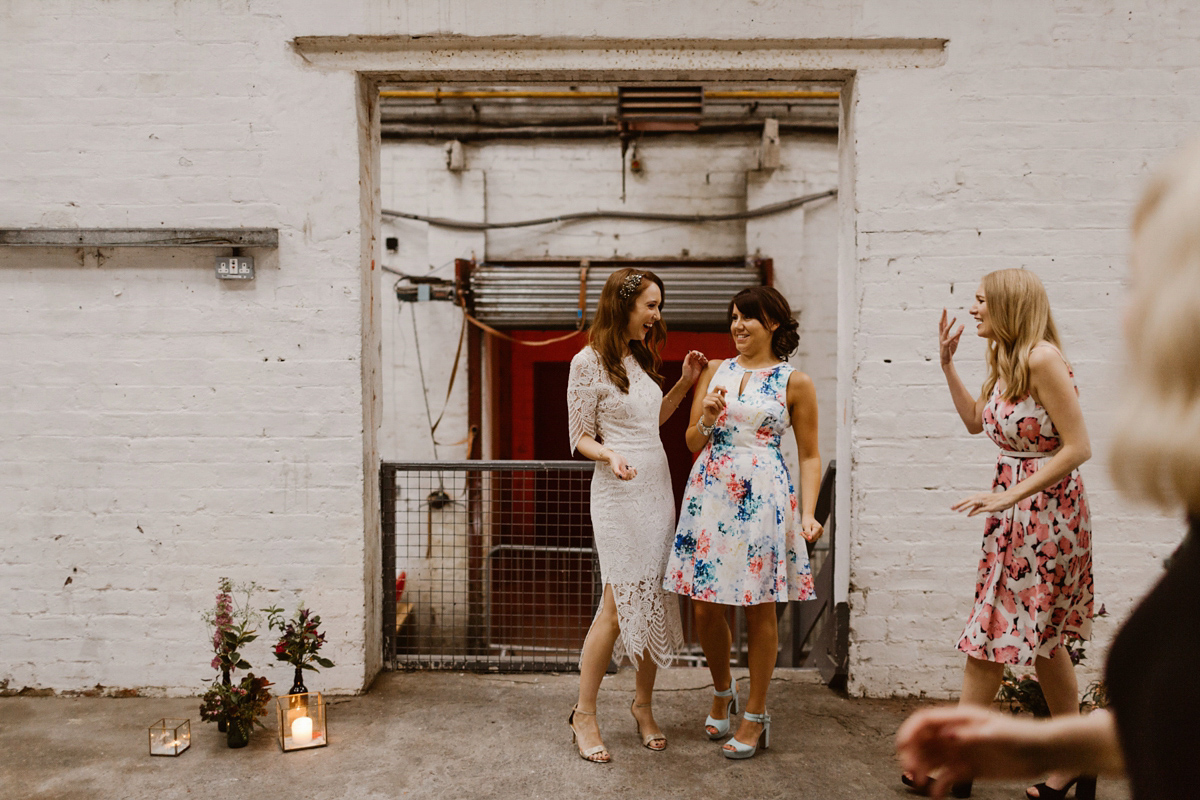 Katie wore a For Love & Lemons dress for her cool, modern, warehouse wedding in Glasgow. Photography by The Curries.