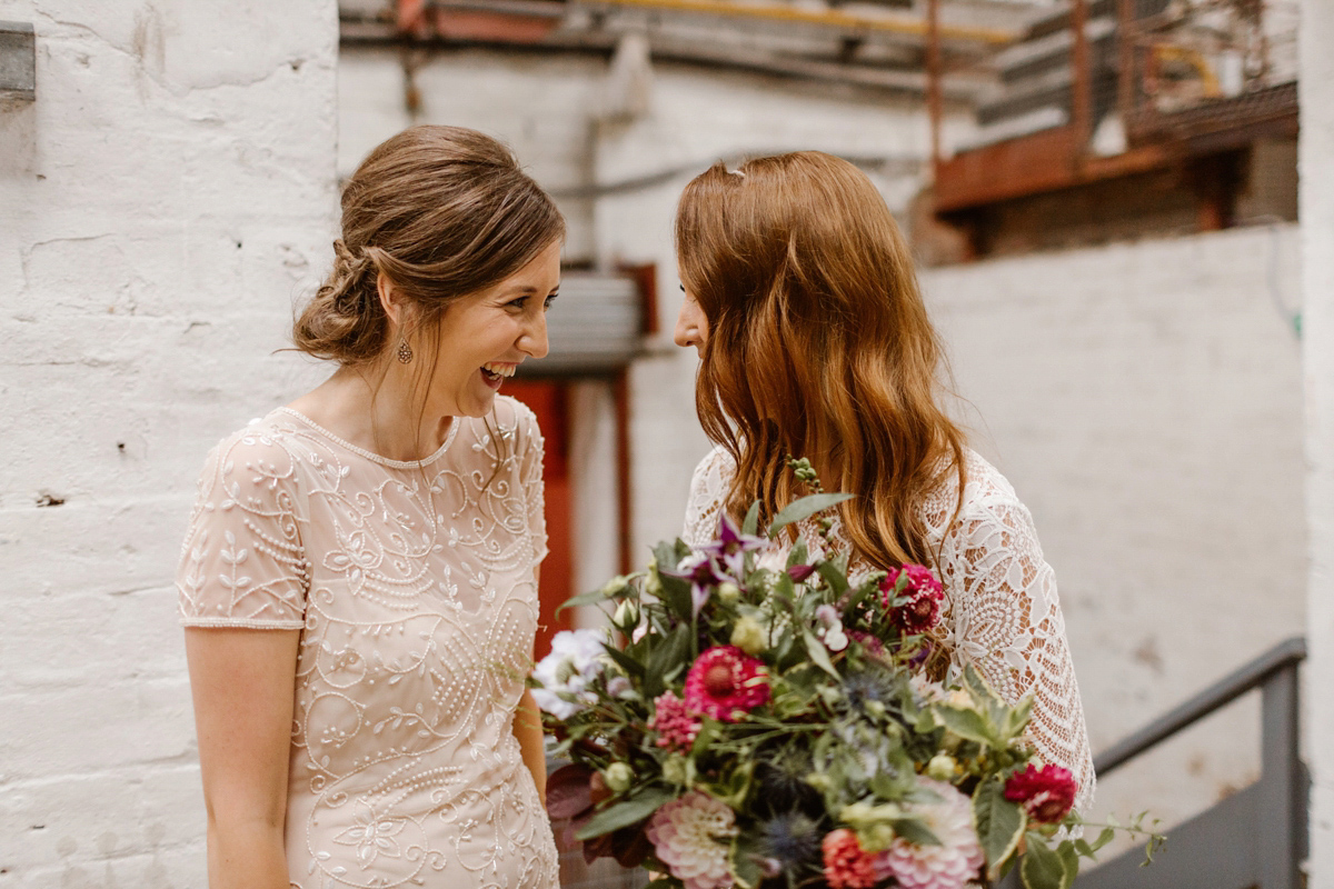 Katie wore a For Love & Lemons dress for her cool, modern, warehouse wedding in Glasgow. Photography by The Curries.