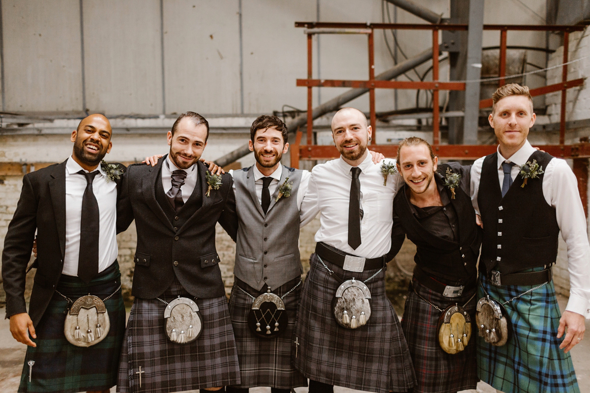 Katie wore a For Love & Lemons dress for her cool, modern, warehouse wedding in Glasgow. Photography by The Curries.