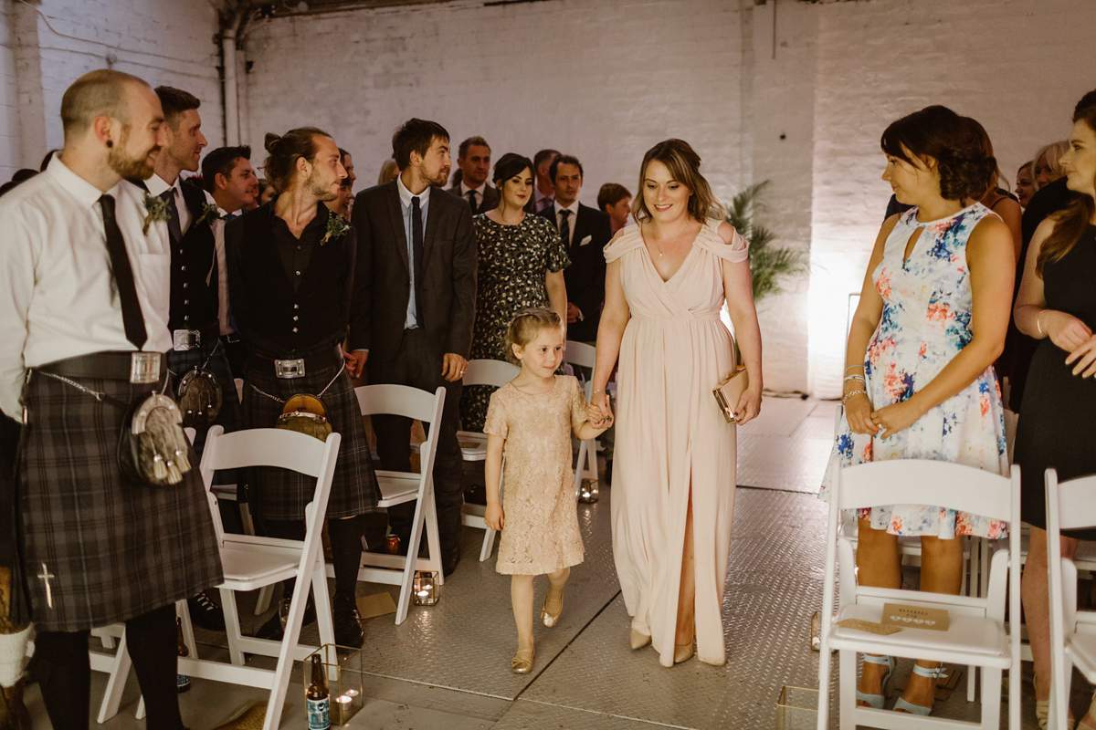 Katie wore a For Love & Lemons dress for her cool, modern, warehouse wedding in Glasgow. Photography by The Curries.