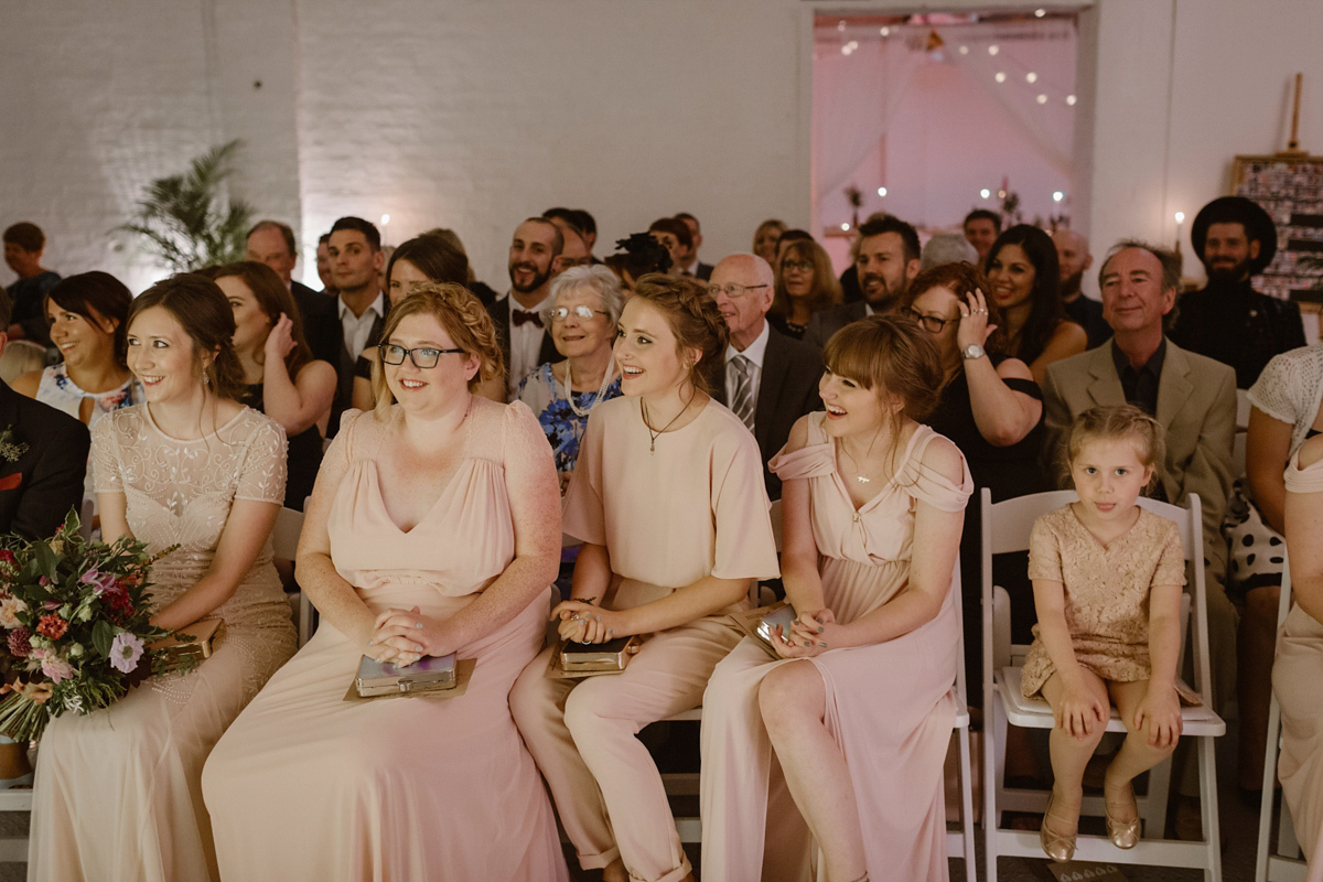 Katie wore a For Love & Lemons dress for her cool, modern, warehouse wedding in Glasgow. Photography by The Curries.