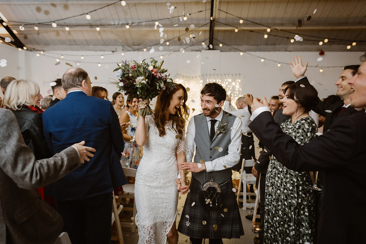 Katie wore a For Love & Lemons dress for her cool, modern, warehouse wedding in Glasgow. Photography by The Curries.