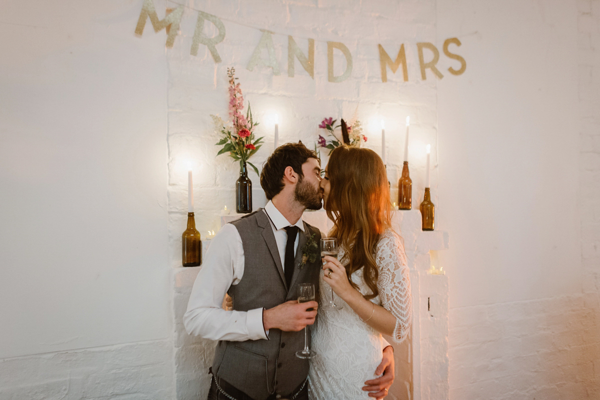 Katie wore a For Love & Lemons dress for her cool, modern, warehouse wedding in Glasgow. Photography by The Curries.