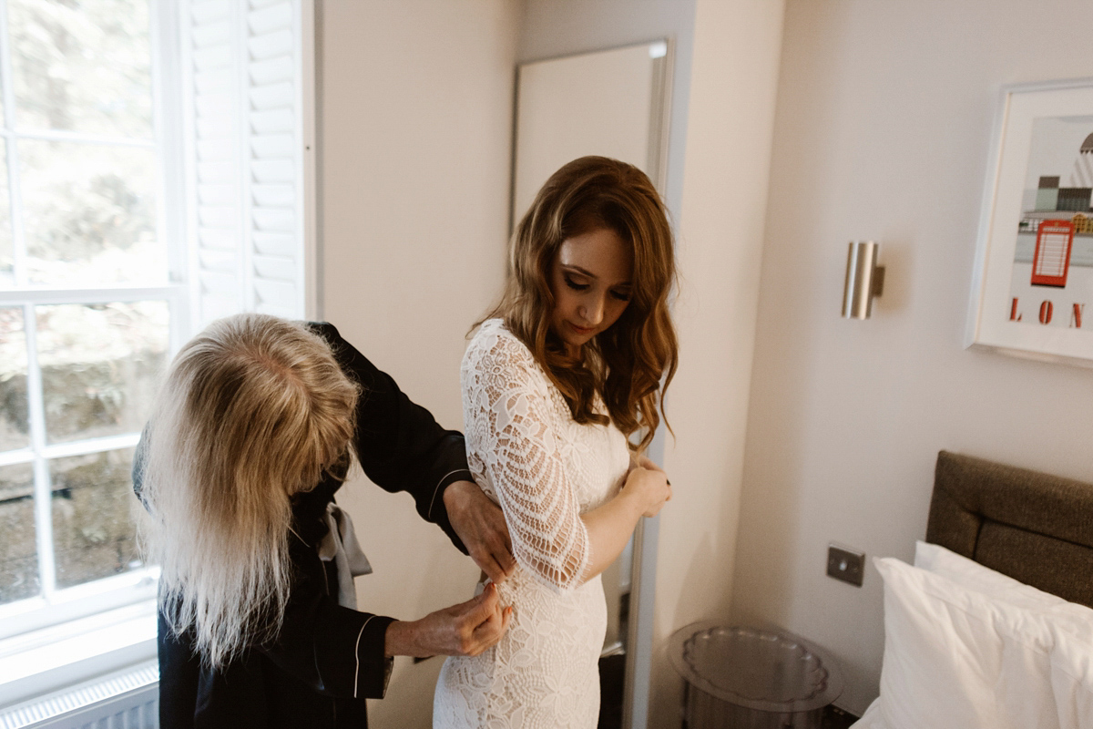 Katie wore a For Love & Lemons dress for her cool, modern, warehouse wedding in Glasgow. Photography by The Curries.