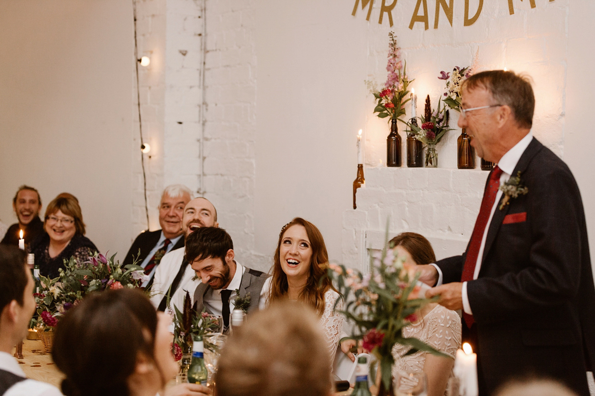 Katie wore a For Love & Lemons dress for her cool, modern, warehouse wedding in Glasgow. Photography by The Curries.