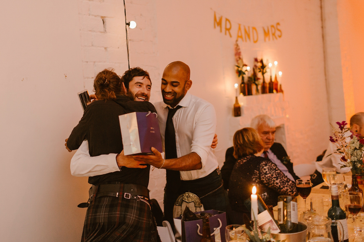 Katie wore a For Love & Lemons dress for her cool, modern, warehouse wedding in Glasgow. Photography by The Curries.