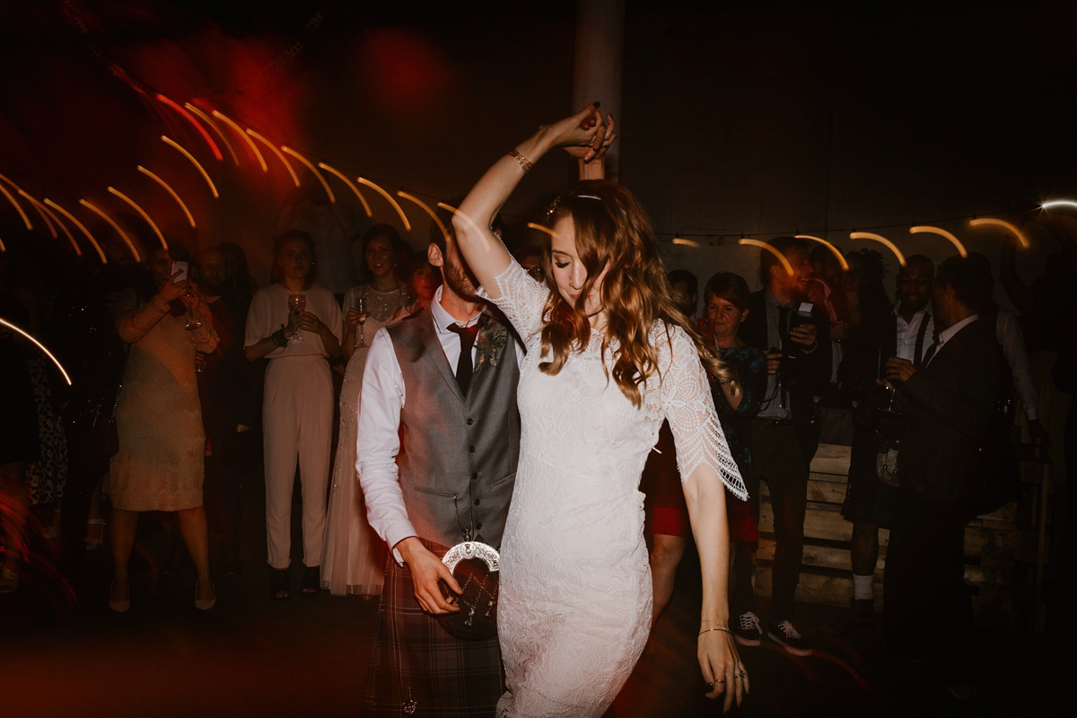 Katie wore a For Love & Lemons dress for her cool, modern, warehouse wedding in Glasgow. Photography by The Curries.