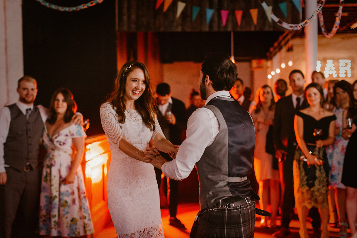 Katie wore a For Love & Lemons dress for her cool, modern, warehouse wedding in Glasgow. Photography by The Curries.