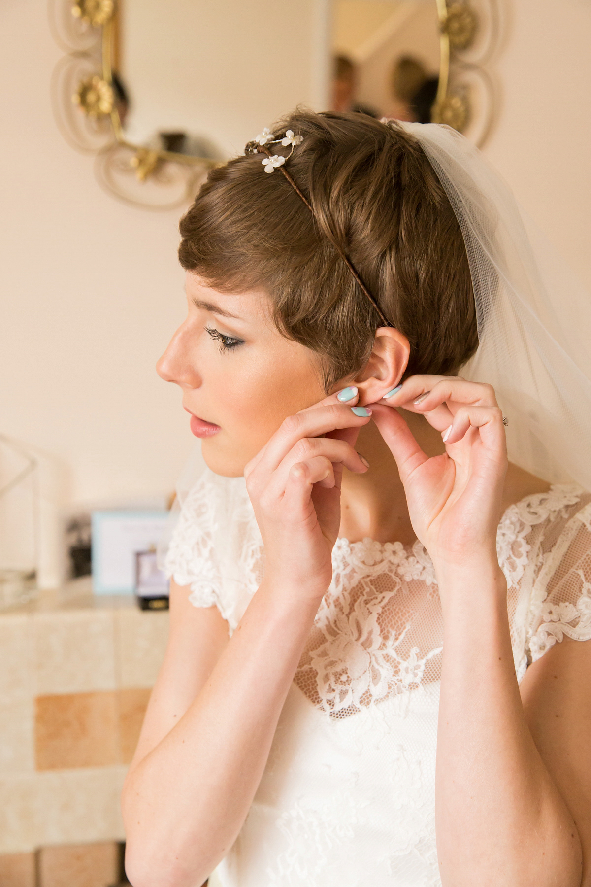 Jo wore a retro inspired Sassi Holford gown from Ellie Sanderson bridal boutique and a pair of Charlotte Mills shoes for her 'silent disco' wedding. Photography by Hannah Larkin.