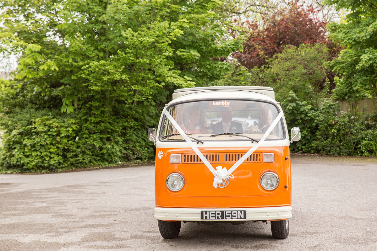 Jo wore a retro inspired Sassi Holford gown from Ellie Sanderson bridal boutique and a pair of Charlotte Mills shoes for her 'silent disco' wedding. Photography by Hannah Larkin.