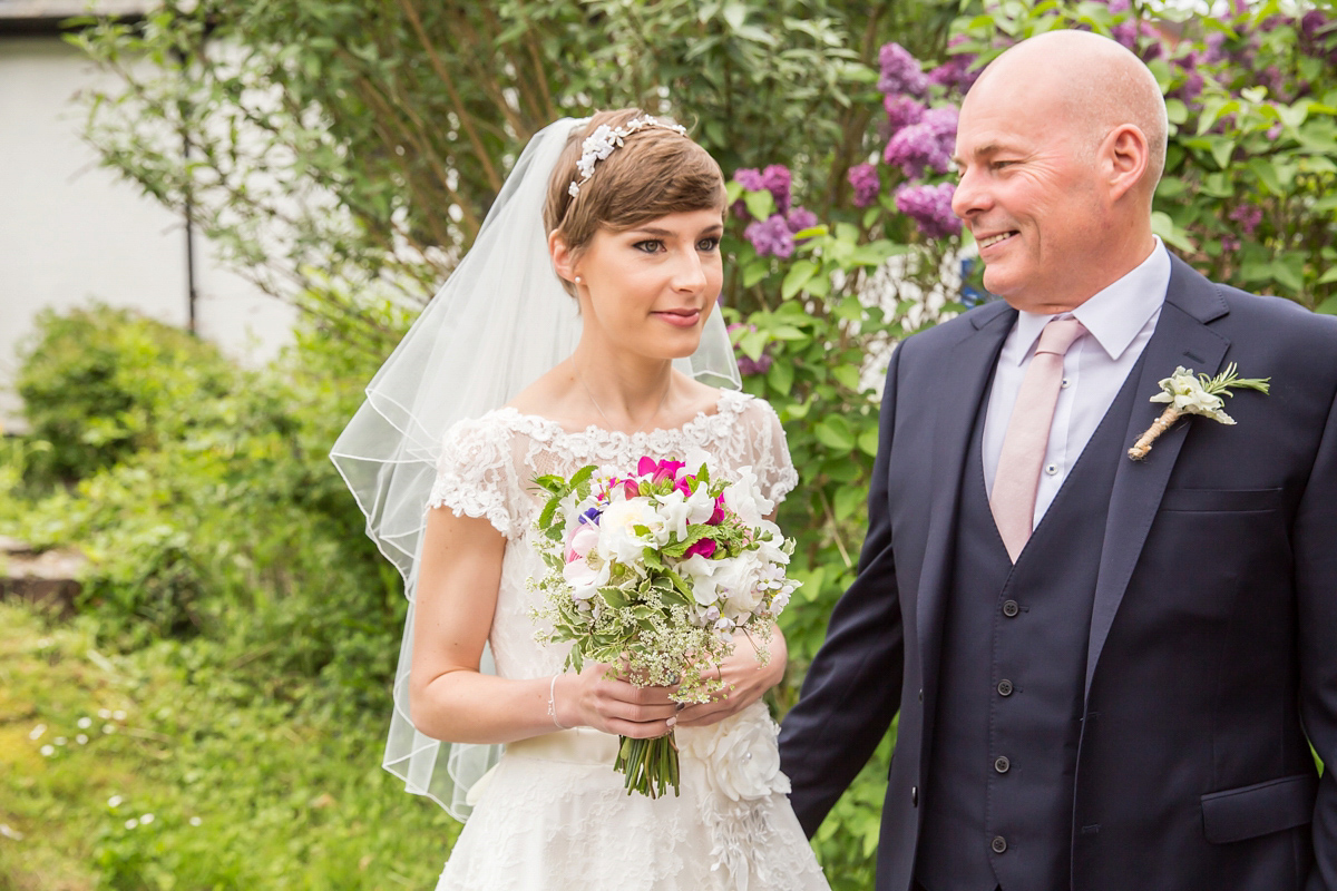 Jo wore a retro inspired Sassi Holford gown from Ellie Sanderson bridal boutique and a pair of Charlotte Mills shoes for her 'silent disco' wedding. Photography by Hannah Larkin.