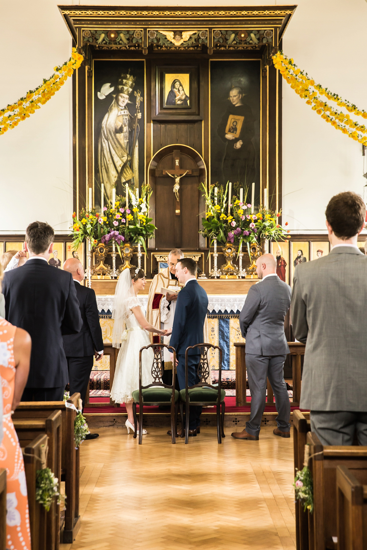 Jo wore a retro inspired Sassi Holford gown from Ellie Sanderson bridal boutique and a pair of Charlotte Mills shoes for her 'silent disco' wedding. Photography by Hannah Larkin.