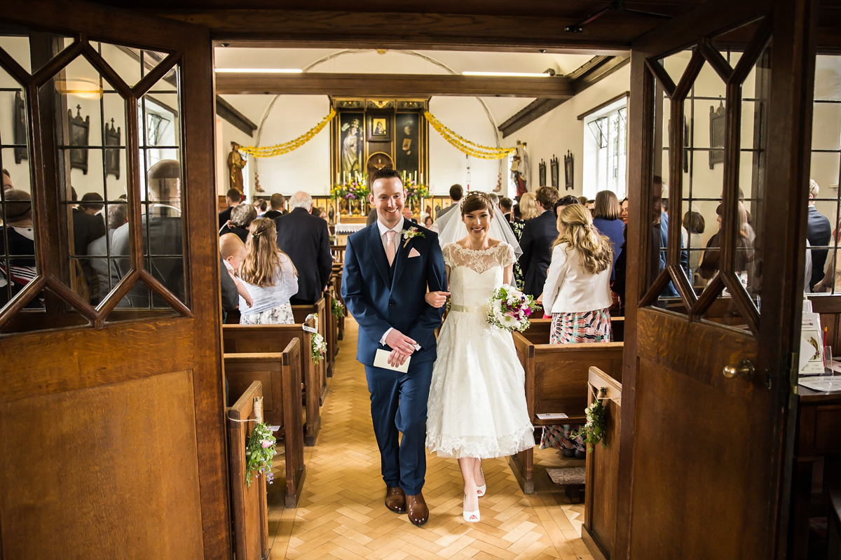 Jo wore a retro inspired Sassi Holford gown from Ellie Sanderson bridal boutique and a pair of Charlotte Mills shoes for her 'silent disco' wedding. Photography by Hannah Larkin.