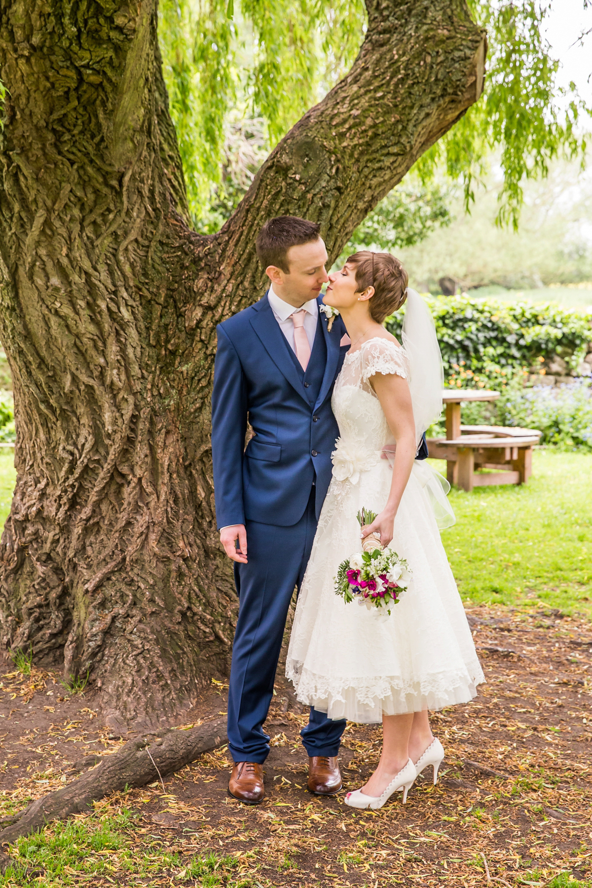 Jo wore a retro inspired Sassi Holford gown from Ellie Sanderson bridal boutique and a pair of Charlotte Mills shoes for her 'silent disco' wedding. Photography by Hannah Larkin.