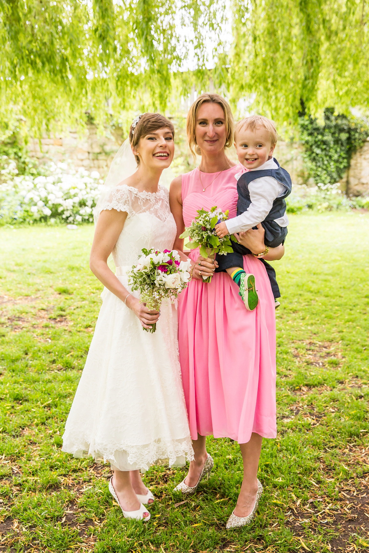 Jo wore a retro inspired Sassi Holford gown from Ellie Sanderson bridal boutique and a pair of Charlotte Mills shoes for her 'silent disco' wedding. Photography by Hannah Larkin.