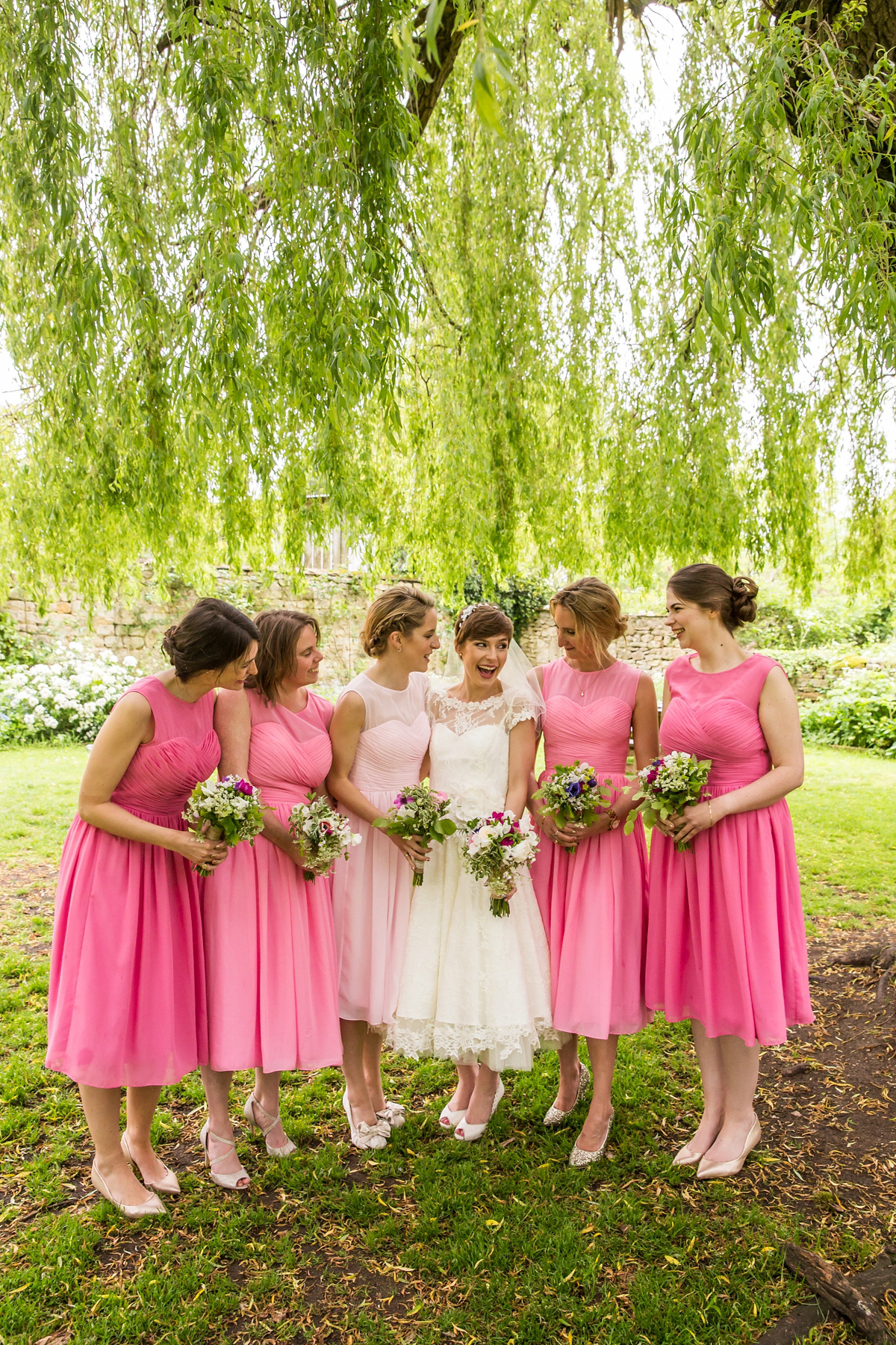 Jo wore a retro inspired Sassi Holford gown from Ellie Sanderson bridal boutique and a pair of Charlotte Mills shoes for her 'silent disco' wedding. Photography by Hannah Larkin.