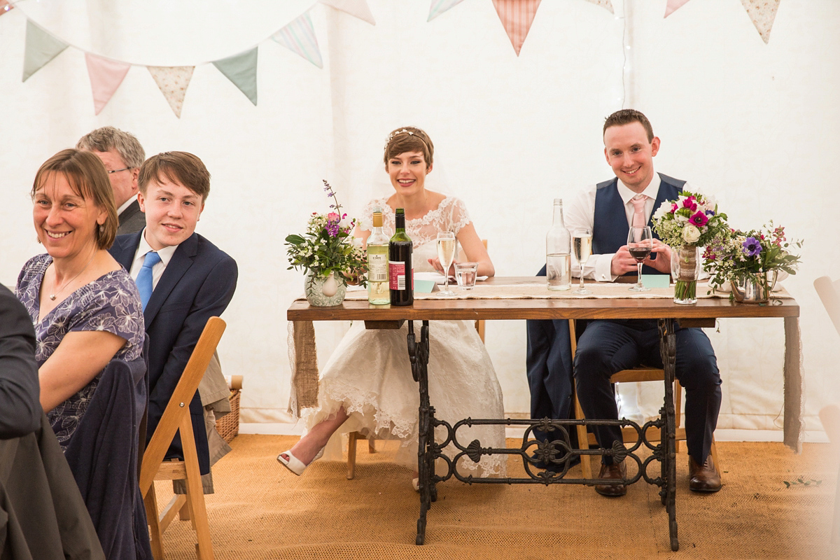 Jo wore a retro inspired Sassi Holford gown from Ellie Sanderson bridal boutique and a pair of Charlotte Mills shoes for her 'silent disco' wedding. Photography by Hannah Larkin.