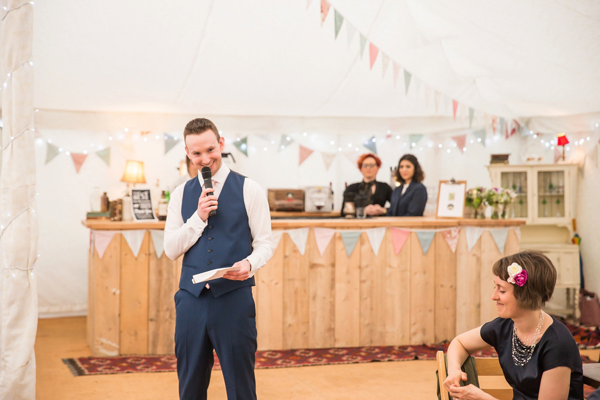 Jo wore a retro inspired Sassi Holford gown from Ellie Sanderson bridal boutique and a pair of Charlotte Mills shoes for her 'silent disco' wedding. Photography by Hannah Larkin.