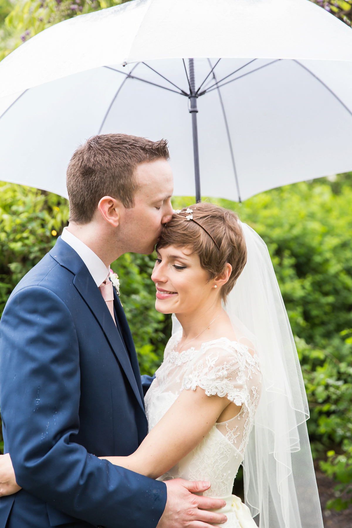 Jo wore a retro inspired Sassi Holford gown from Ellie Sanderson bridal boutique and a pair of Charlotte Mills shoes for her 'silent disco' wedding. Photography by Hannah Larkin.