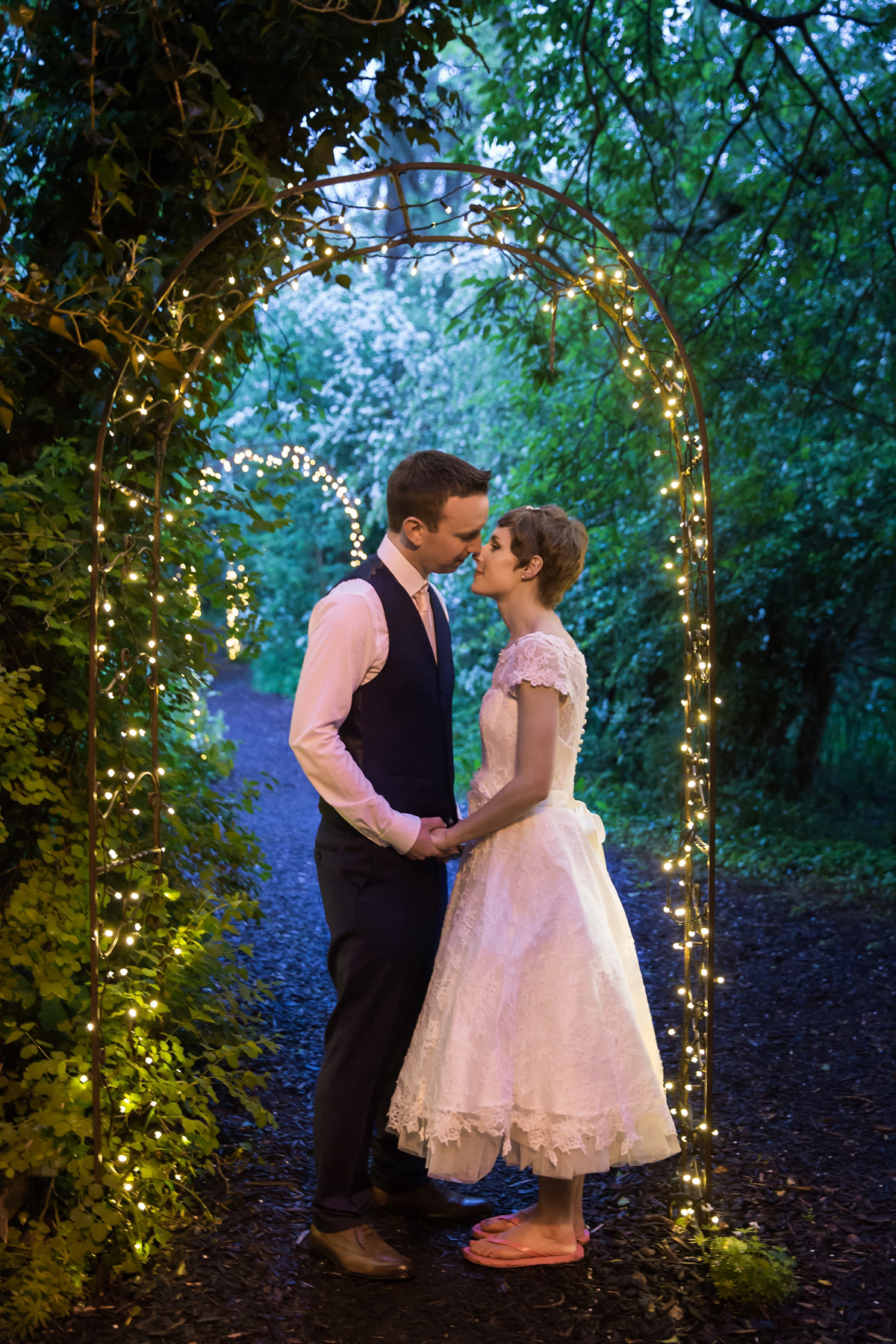 Jo wore a retro inspired Sassi Holford gown from Ellie Sanderson bridal boutique and a pair of Charlotte Mills shoes for her 'silent disco' wedding. Photography by Hannah Larkin.