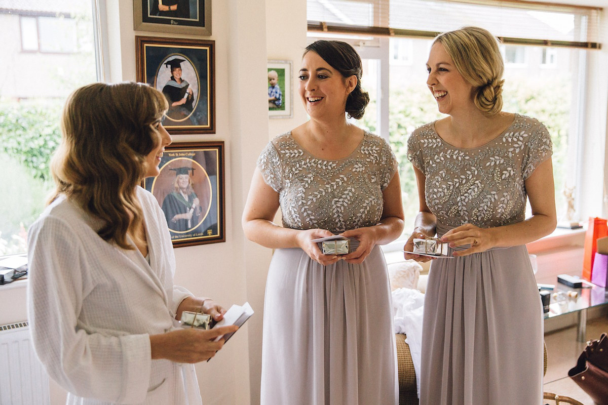 Caroline wore a Martina Liana gown for her elegant rainy day barn wedding. Images captured by Red On Blonde Photography.