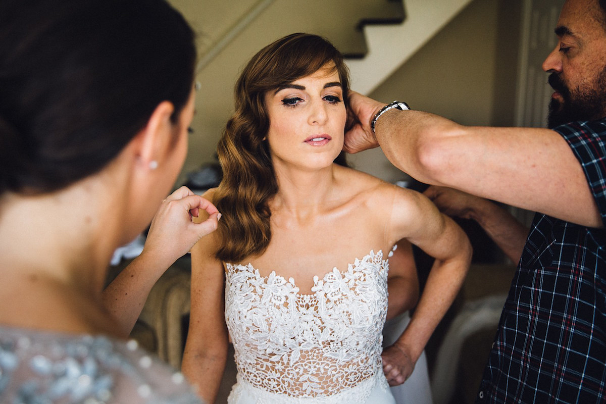 Caroline wore a Martina Liana gown for her elegant rainy day barn wedding. Images captured by Red On Blonde Photography.