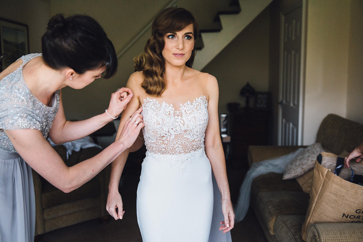 Caroline wore a Martina Liana gown for her elegant rainy day barn wedding. Images captured by Red On Blonde Photography.