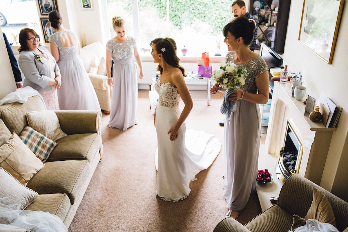 Caroline wore a Martina Liana gown for her elegant rainy day barn wedding. Images captured by Red On Blonde Photography.