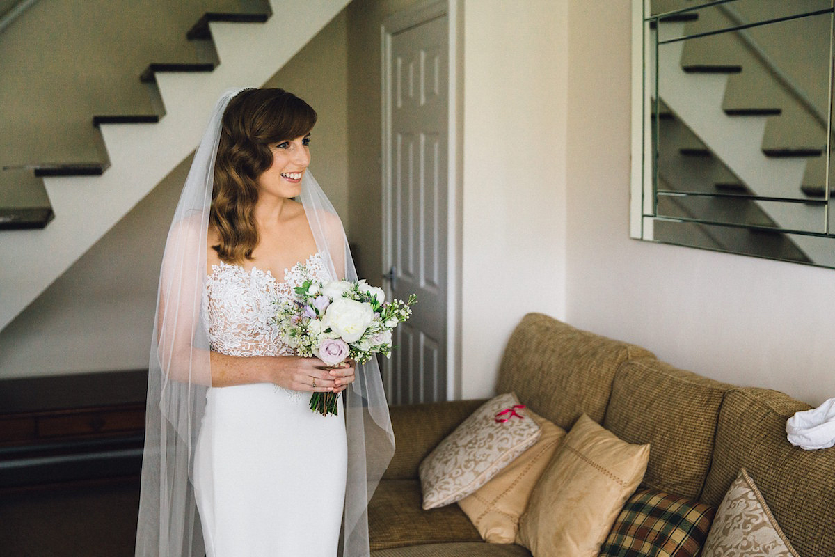 Caroline wore a Martina Liana gown for her elegant rainy day barn wedding. Images captured by Red On Blonde Photography.