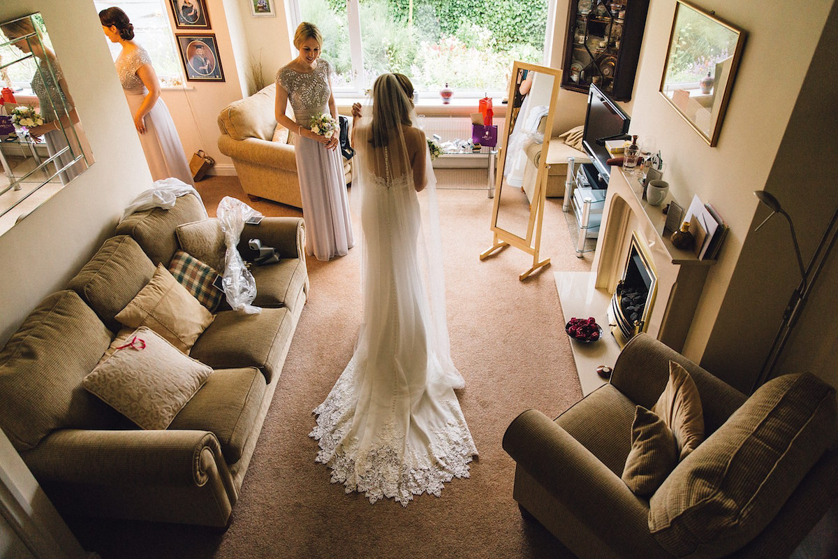 Caroline wore a Martina Liana gown for her elegant rainy day barn wedding. Images captured by Red On Blonde Photography.